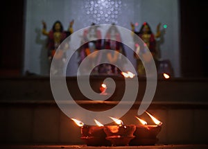 Close up candle lit lit during diwali festival