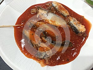 Close up canned fish with tomato sauce