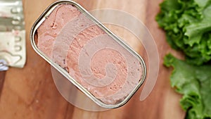 close up of canned meat on table
