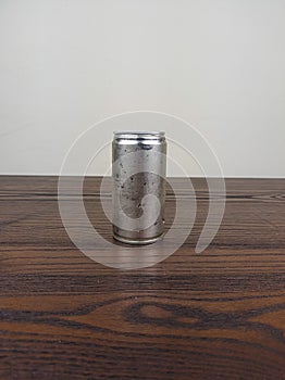 close up cans of cold energy drinks on a wooden table