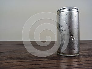 close up cans of cold energy drinks on a wooden table