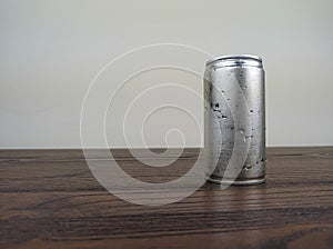 close up cans of cold energy drinks on a wooden table