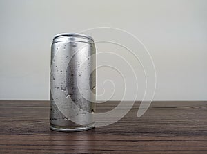 close up cans of cold energy drinks on a wooden table