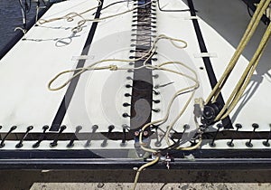 Close up of canvas and catamaran ropes made for regattas and day sailing. Nautical boat pattern. The trampoline is placed along