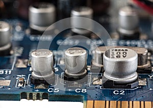 Close up of capacitor on printed computer circuit board