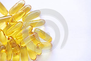 Close up of capsules Omega 3 on white background. Copy space for your text.