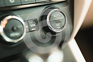 Close-up car air conditioner ventilation system control knobs