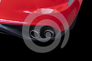 Close up of a car dual exhaust pipe. Double exhaust pipes of a red modern sports car. Car exterior details. New car parts with