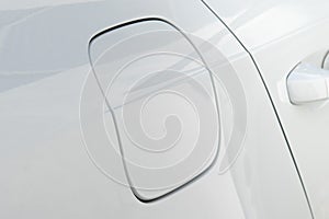 Close-up of the car gas tank door, white