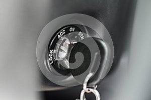 Close up of car key in keyhole for ignition. Car keys in ignition about to start the car. Macro of modern start car key