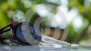 Close up car keys placed on the table, outdoors