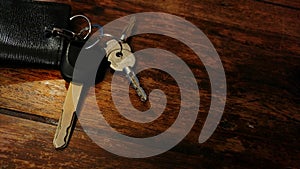 Close-up car keys on a wooden table top view