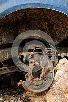 Close-up car with missing wheels stolen car wheel pollution and crime problem conversation vintage rusted detail discarded in