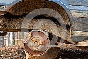 Close-up car with missing wheels stolen car wheel pollution and crime problem conversation vintage rusted detail discarded in