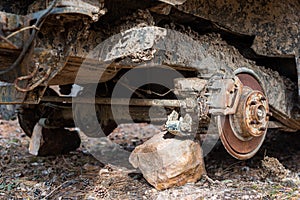 Close-up car with missing wheels stolen car wheel pollution and crime problem conversation vintage rusted detail discarded in