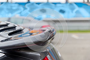 Close up of car spoiler on speedway at stadium