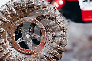 Close-up of car tires in dirt road