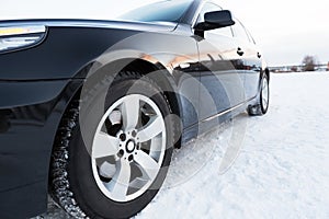 Close up of car tires on the winter road