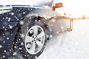 Close up of car tires on the winter road