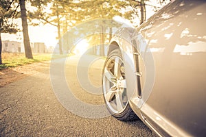 Close up on a car tyre while drifting on a street