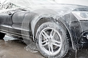 Close-up of a car during the washing process