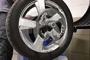 Close-up of a car wheel during balancing in a car photo