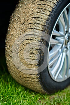 Close up of a Car wheel on a dirt road