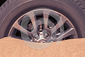 Close up of a car wheel stuck in the sand in the Namib desert