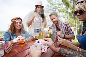 Close up of cards in hands of male