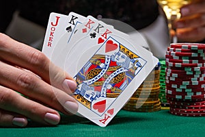 Close-up cards for playing poker on a gaming table in a casino against a background of chips. Background for a gaming business