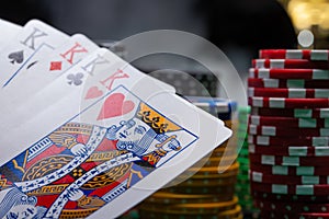 Close-up cards for playing poker on a gaming table in a casino against a background of chips. Background for a gaming business