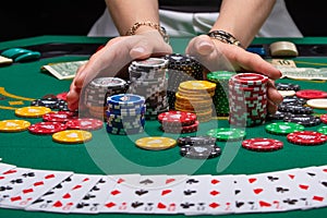 Close-up cards for playing poker on a gaming table in a casino against a background of chips. Background for a gaming business