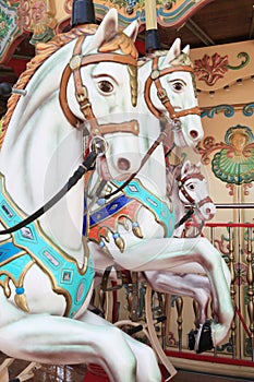 Close-up of carousel horses for children amusement in France