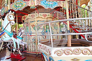 Close-up of carousel horses for children amusement in France