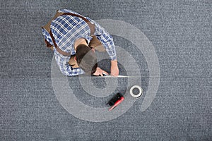 Carpenter Laying Carpet