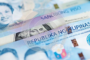 Close up of cash banknote of one thousand Philippines peso and us dollar, macro