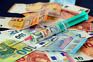 Close up of a cash injection and different euro banknotes