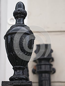 Close-up of cast iron newel post.
