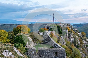 Close up of castle walls and tower on the top of the hill.