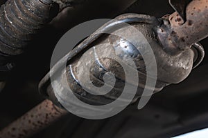 Close-up of Catalytic Converter in Car Exhaust System. The concept of preserving ecology, reducing harmful emissions into the air