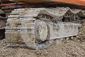 Close up of caterpillar on pile of dirt