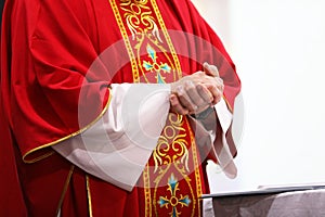 Priest serving Catholic Mass symbols, objects and parts