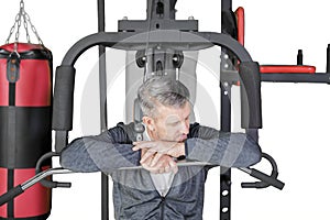 Caucasian man resting while exercising on studio