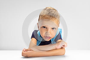Close-up Caucasian preschool boy isolated on white studio background. Copyspace for ad. Childhood, education, emotion