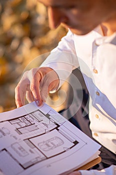 Close up of caucasian realtor reading documents