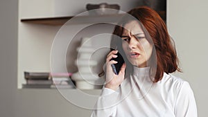 Close up Caucasian upset frustrated sad worried woman girl businesswoman talking mobile phone business call problem