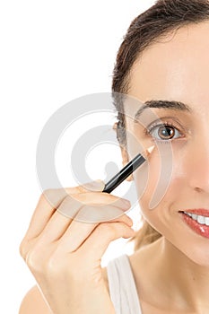 Close up caucasian woman applying eyeliner