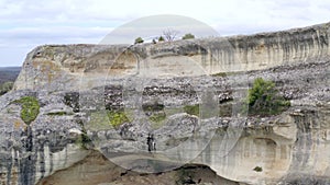 Close up of cave dwellings in rocks. Ancient city fortress on impregnable rock