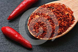 Close up of cayenne pepper in wooden spoon