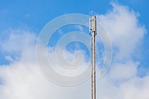 Close up Cellular transmitter, dipole antenna for telecommunications with clear blue sky background.